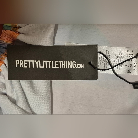 PrettyLittleThing Peach Pastel Abstract Print Plunge Ruched Swimsuit - Picture 7 of 7